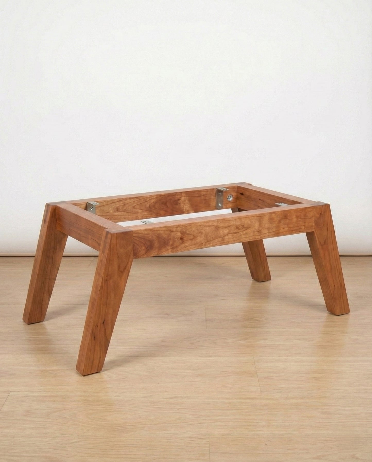 The Fjord solid wood coffee table base mid-century modern, side angle view – Artisan & Sons
