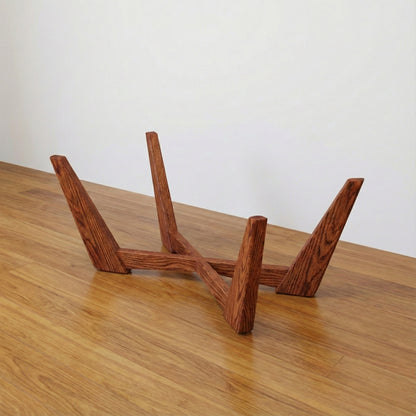 The Nexus solid wood cross-base coffee table mid-century modern, styled room setting – Artisan & Sons