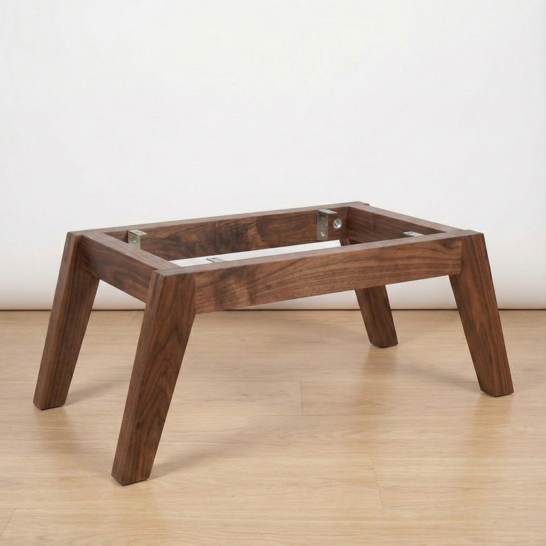 The Fjord solid wood coffee table base mid-century modern, hero lifestyle view – Artisan & Sons