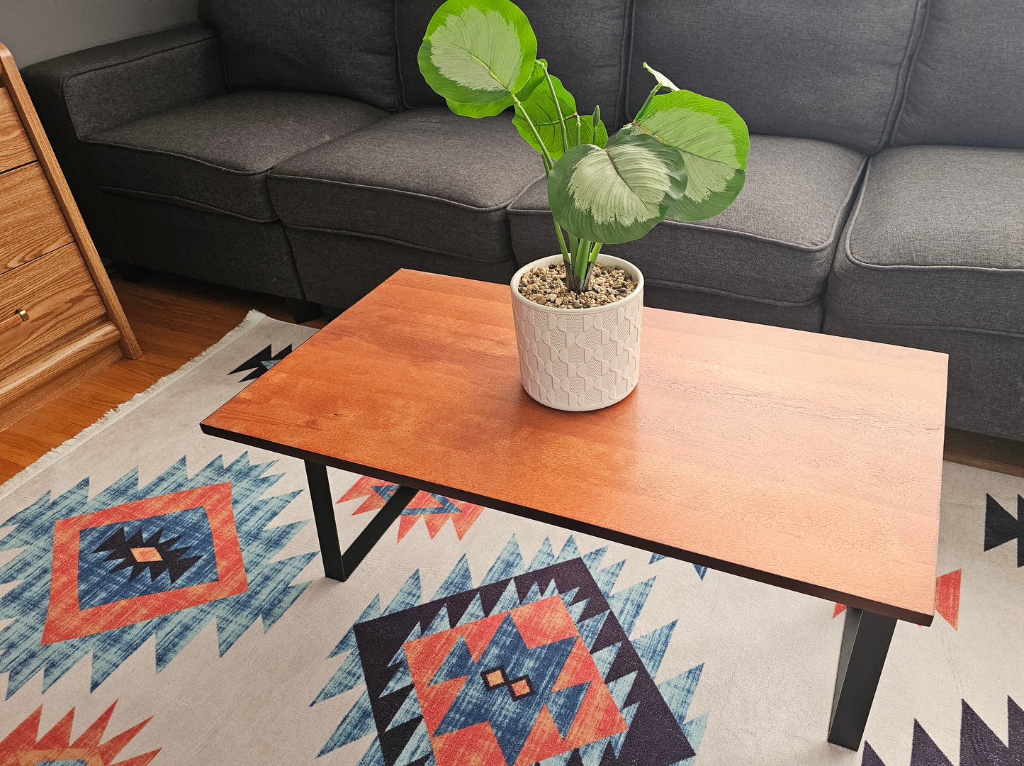 Solid Birch Coffee Table with Black Metal Trapezoid Legs – Natural Dark Honey Finish, 36"x20"